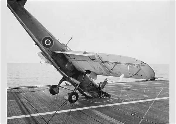 Fairey Barracuda II, hitting the barrier and falling onto its nose on HMS Ravager