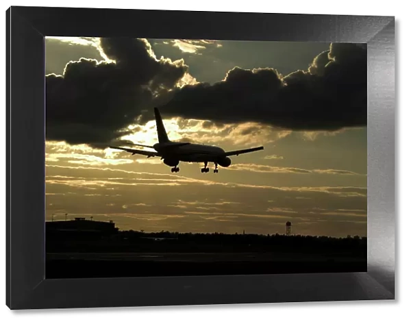 Boeing 757 landing in sunset