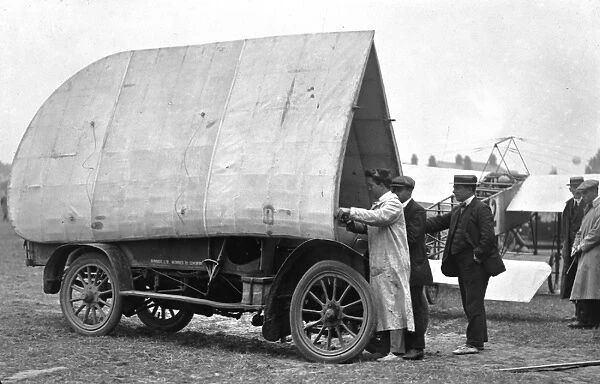 G. A. Barnes packs wings of Humber-Bleriot monoplane onto Humber car