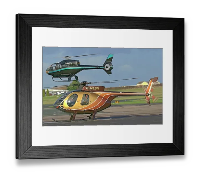 Framed Print : Eurocopter EC120 and MD500 helicopters