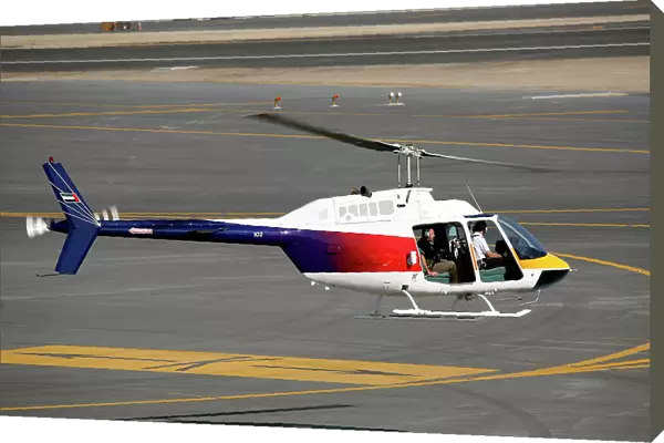 Bell 206 Jetranger taking-off for photo shoot at Dubai Airshow 2005