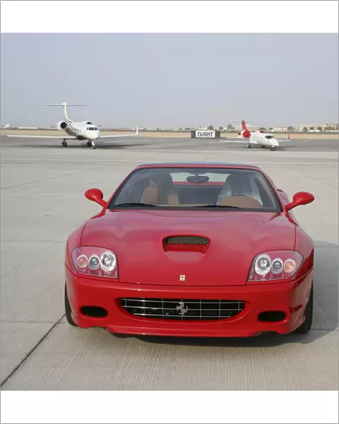 Ferrari car with executive jets at Dubai Airshow 2005