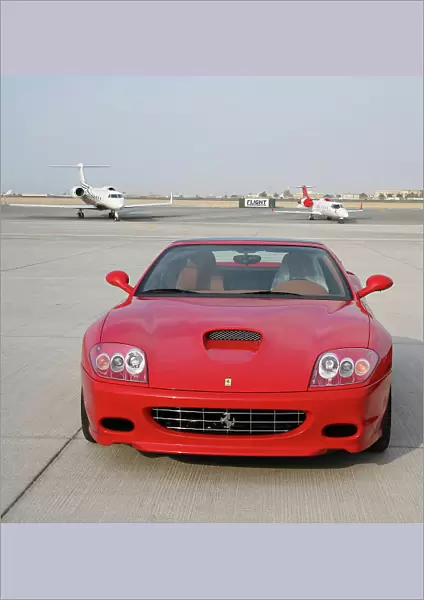 Ferrari car with executive jets at Dubai Airshow 2005
