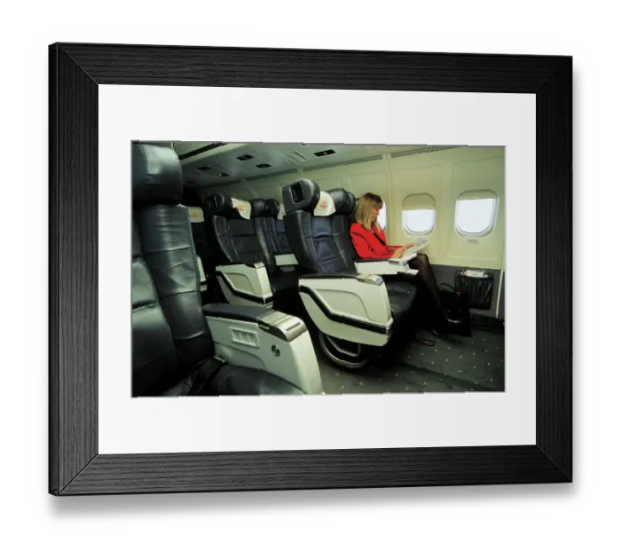 Framed Print : Female passenger in business class on MDC MD83 AOM airliner Framed Print : Female passenger in business class on MDC MD83 AOM airliner