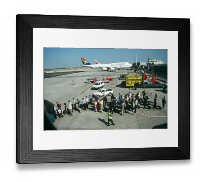 Framed Print : Passengers queue to board up steps at Jo berg Airport South Africa Framed Print : Passengers queue to board up steps at Jo berg Airport South Africa
