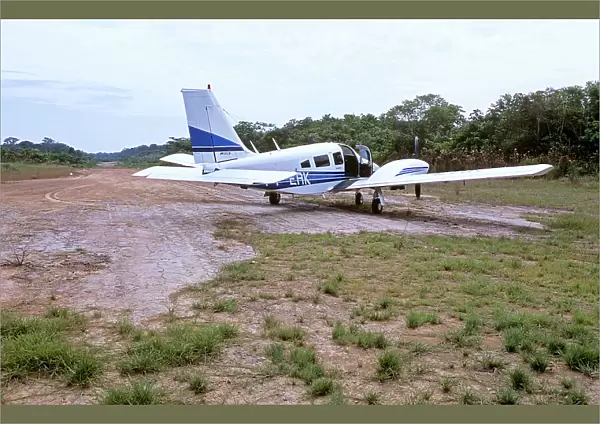 Piper Seneca on dirt airstrip in Amazon jungle, South America