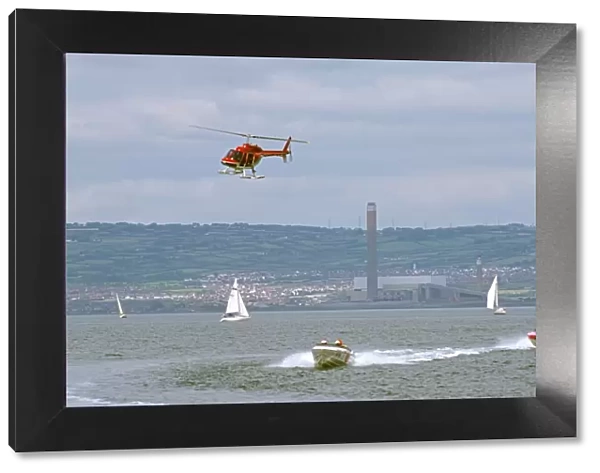 Helicopter being used to film power boat race