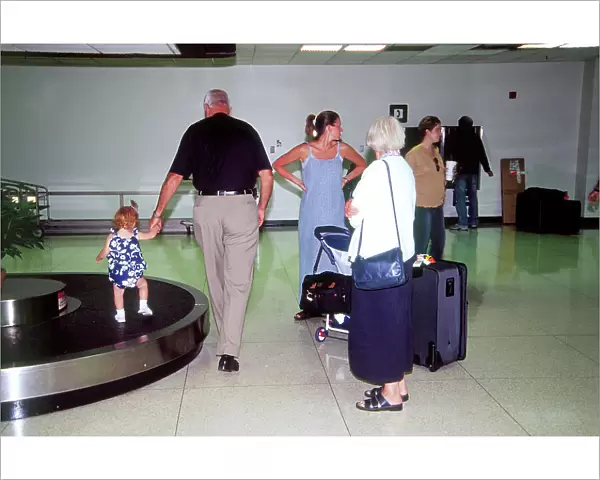 Small child on baggage belt