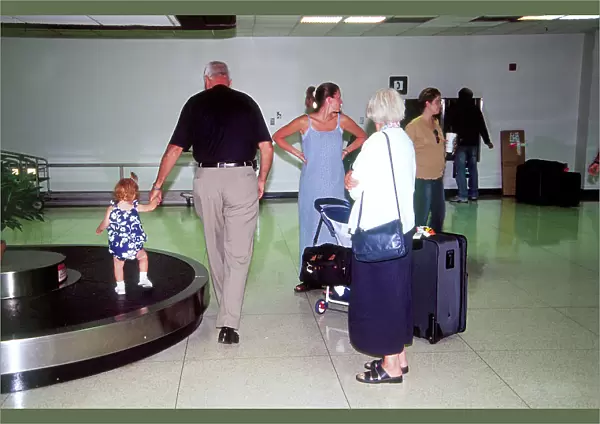 Small child on baggage belt