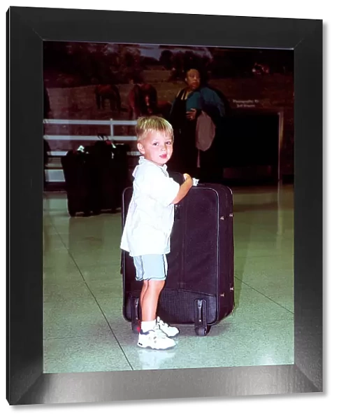 Small boy big suitcase