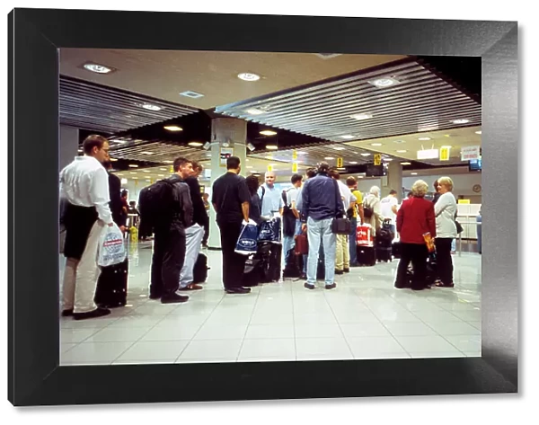Passengers queue for visas
