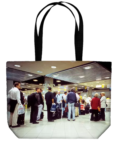 Passengers queue for visas