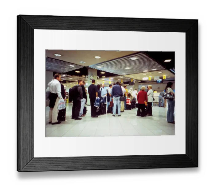 Framed Print : Passengers queue for visas