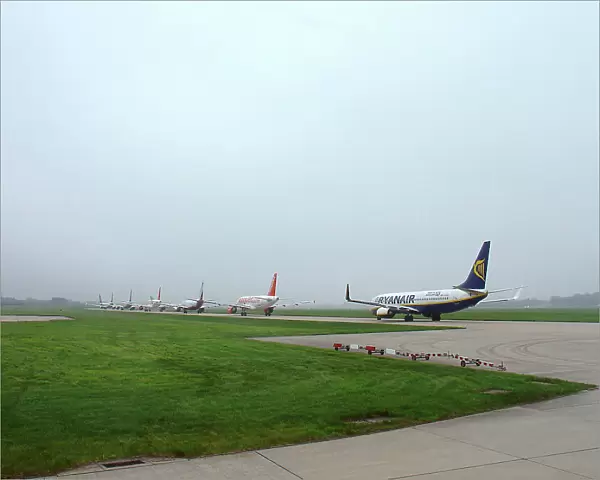 Budget airliners queue for take-off at Stansted Airport, UK