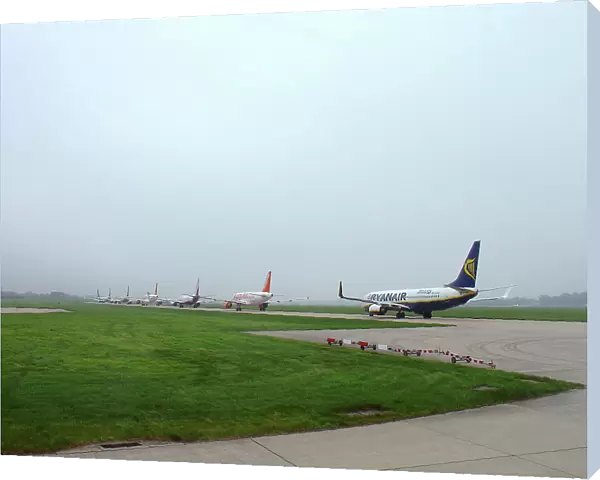 Budget airliners queue for take-off at Stansted Airport, UK