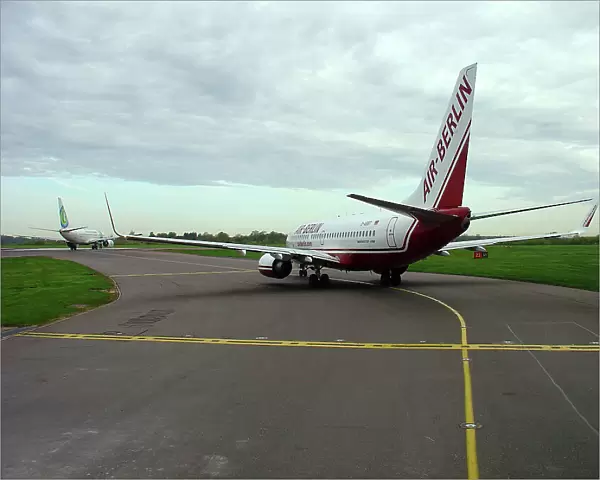 Boeing 737-800 Air Berlin taxiing in queue at Stansted Airport