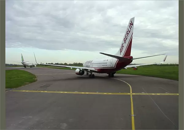 Boeing 737-800 Air Berlin taxiing in queue at Stansted Airport
