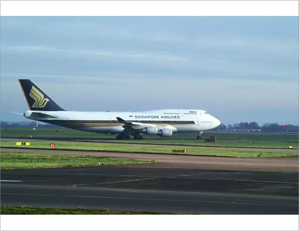singapore airlines 747-412;manchester airport;taxing;bright and overcast;