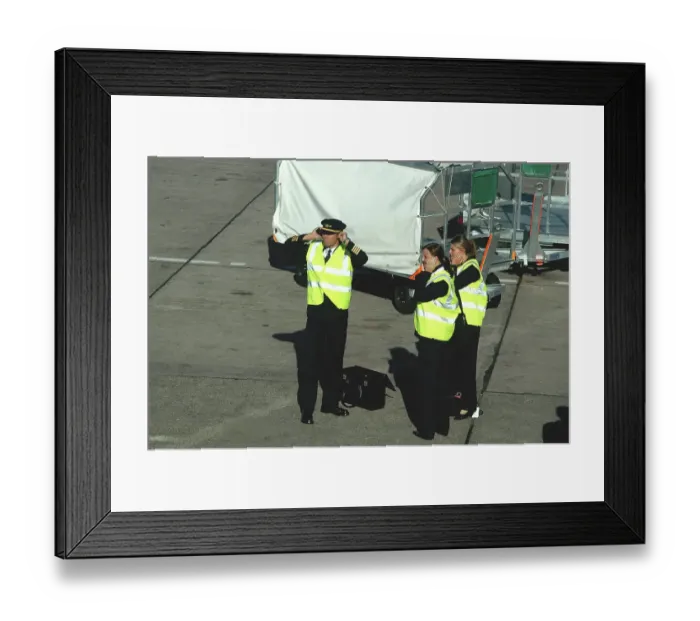 Framed Print : Aer Arran flight crew protecting hearing whilst standing on tarmac at Cork Airport, Ireland Framed Print : Aer Arran flight crew protecting hearing whilst standing on tarmac at Cork Airport, Ireland