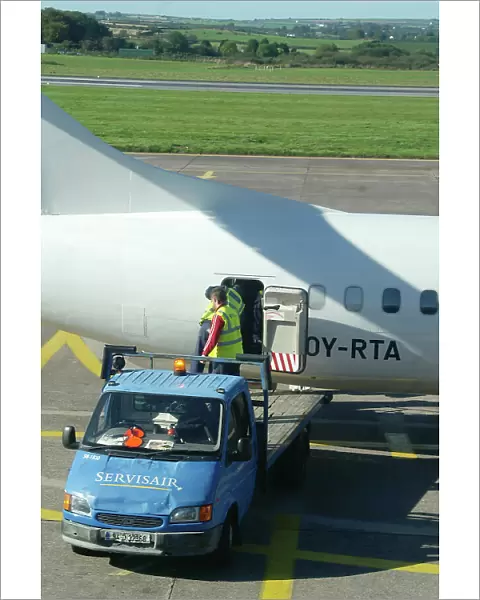 Baggage handlers loading ATR72 at Cork Airport