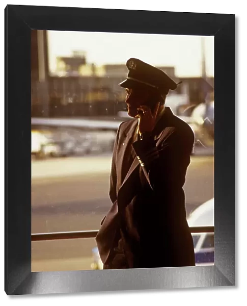 hoare boston logan airport captain onmobile phone in termainal