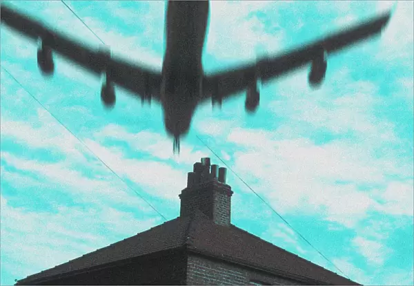 Flying low over house