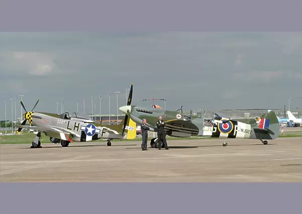 Fighters. P-51 9G-MSTG) and B of B two seat Spitfire at BHX May 2003 for