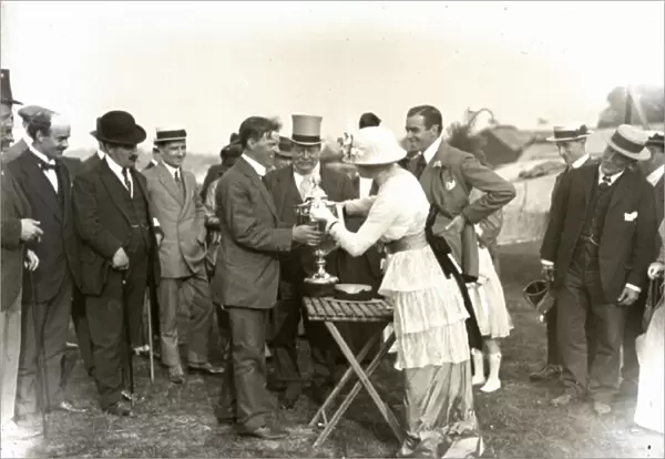 viator Walter L. Brock receiving trophy from Lady Reid