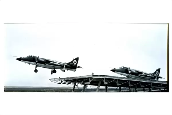 Sea Harriers launch from the deck of an aircraft carrier