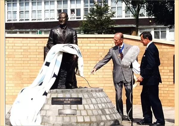 HRH Duke of Edinburgh pulls the de Havilland flag from the statue of Sir Geoffrey
