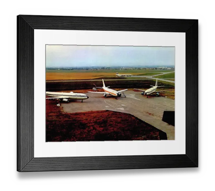 Framed Print : Three Airbus A300 static on the runway
