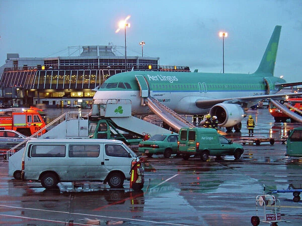 Airbus A320 Aer Lingus at Dubin Airport with evacuation slides deployed and fire service