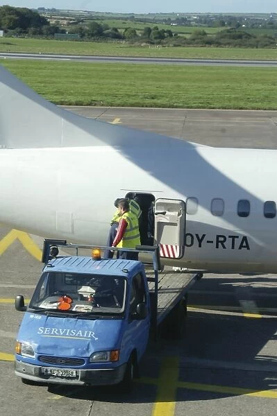 Baggage handlers loading ATR72 at Cork Airport