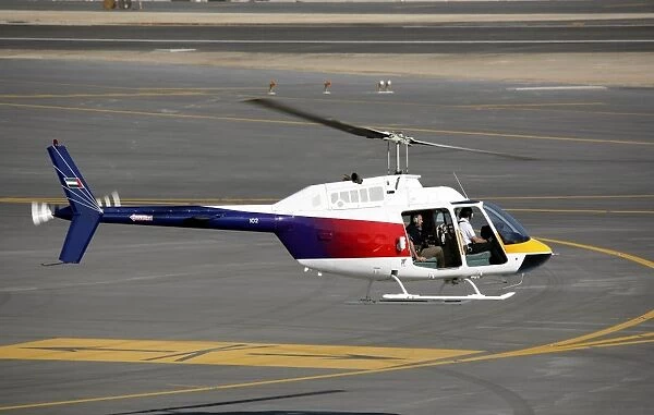 Bell 206 Jetranger taking-off for photo shoot at Dubai Airshow 2005