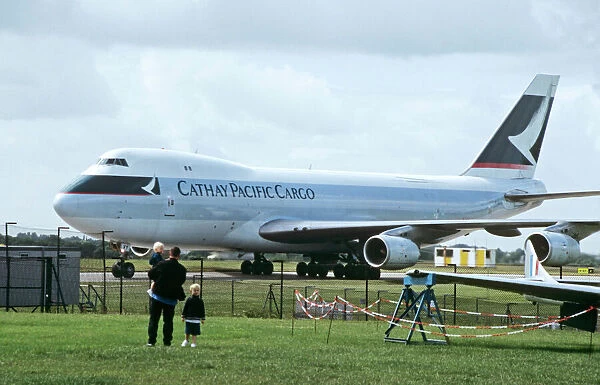 Boeing 747-200F Cathay Pacific Cargo being watched by family
