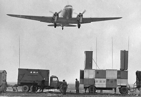 Douglas DC3 flying over controlled ground approach equipment 1947 at Heathrow