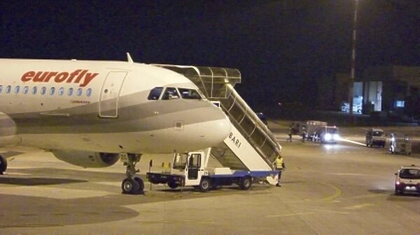 Eurofly Airbus 320 at Bari 12 Jan 07 night shot Forward Fuselage