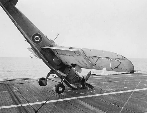 Fairey Barracuda II, hitting the barrier and falling onto its nose on HMS Ravager