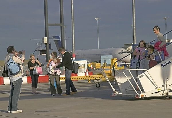 Family photos. Families prepare to leave BHX on their holidays