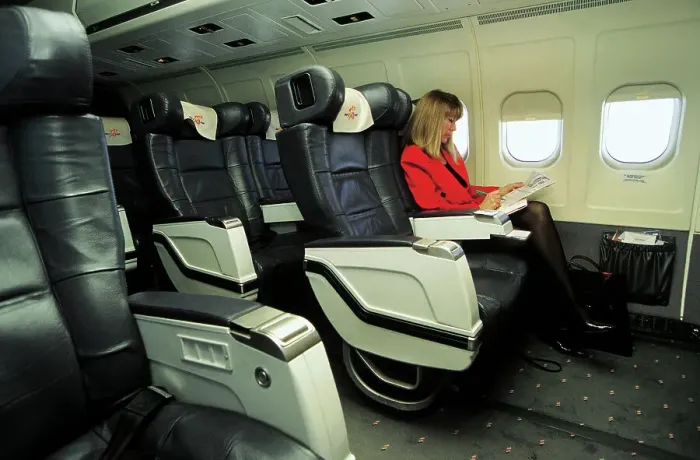 Framed Print : Female passenger in business class on MDC MD83 AOM airliner Framed Print : Female passenger in business class on MDC MD83 AOM airliner