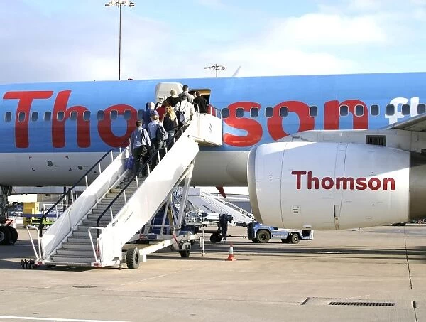 Passenger boarding. Passengers boarding a Thomson Fly B.757
