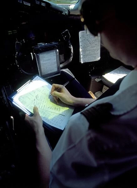Pilot at work. MD83 Air Liberte pilot doing paperwork