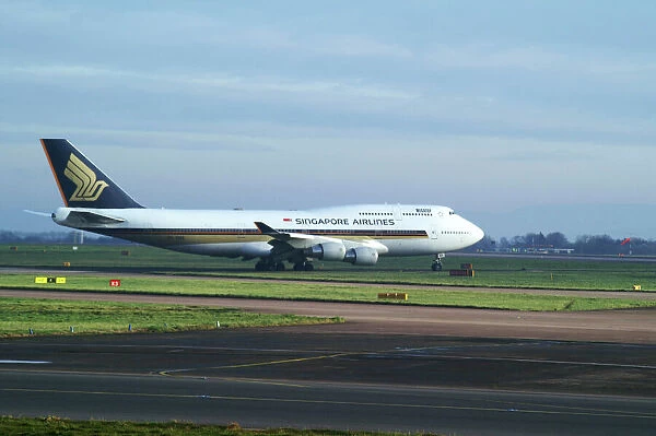 singapore airlines 747-412;manchester airport;taxing;bright and overcast;