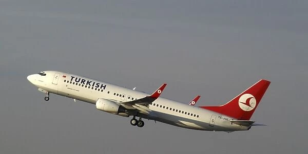 turkish;737-800;Airborne;climbing;blue grey sky;wheels still down