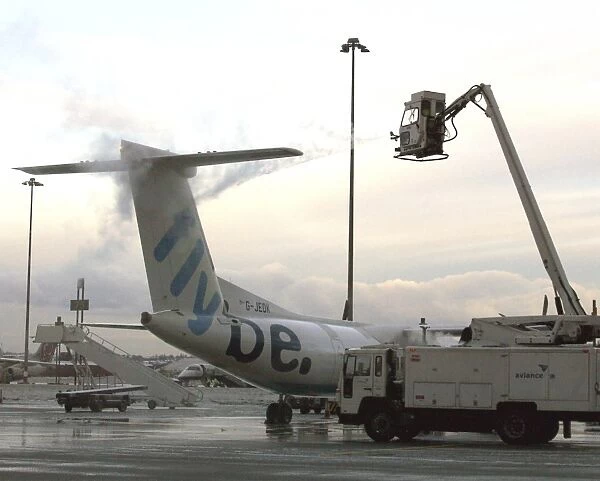 Weather: De-icing. Early morning de-icing FlyBe Dash 8-400
