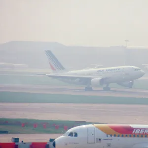 Aircraft landing at Heathrow Airport, London Uk on a misty morning