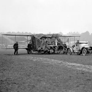 Alex Ogilvies Wriglane half draped in a tarpauline being towed