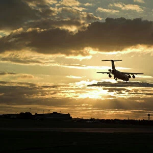 BAe 146 landing in sunset