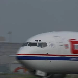 Boeing 737-400 taxying at airport with motion