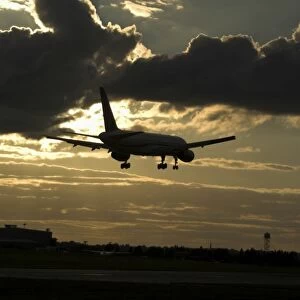 Boeing 757 landing in sunset